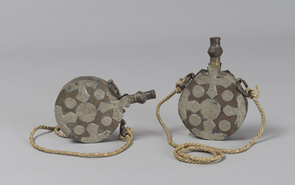 A PAIR OF ARAB GUNPOWDER CONTAINERS, EARLY 20TH CENTURY
