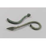 TWO BRONZE HANDLES, 7TH-6TH CENTURY B.C. vertical rod, with one end higher than protome ram and