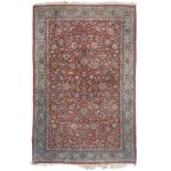 KASHAN CARPET, FIRST HALF 20TH CENTURY dense texture, with design shoots of flowers, rosettes,