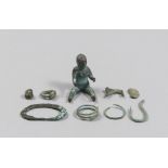 SEVEN ETRUSCANS BRONZE OBJECTS, 8TH-6TH CENTURY B.C. a human figure sitting, a stylized animal