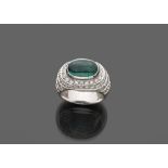 RING in white gold 18 kts., to dome with emerald central and bright of contour. Emerald ct. 2.50