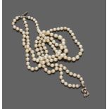 CHOKER to three threads of pearls, with lock in white gold 18 kts. decorated with small diamonds.