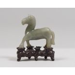 A CHINESE JADE SCULPTURE, 20TH CENTURY depicting a horse. Measures cm. 8,5 x 8,5 x 3. SCULTURA IN