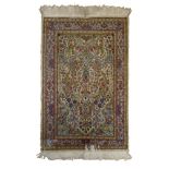 BED RUG KIRMAN, HALF 20TH CENTURY with sketch to forest of flowers, in the central field to white