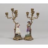 A PAIR OF SMALL BRONZE AND PORCELAIN CANDLESTICKSES, 19TH CENTURY to three braccias to ramages and