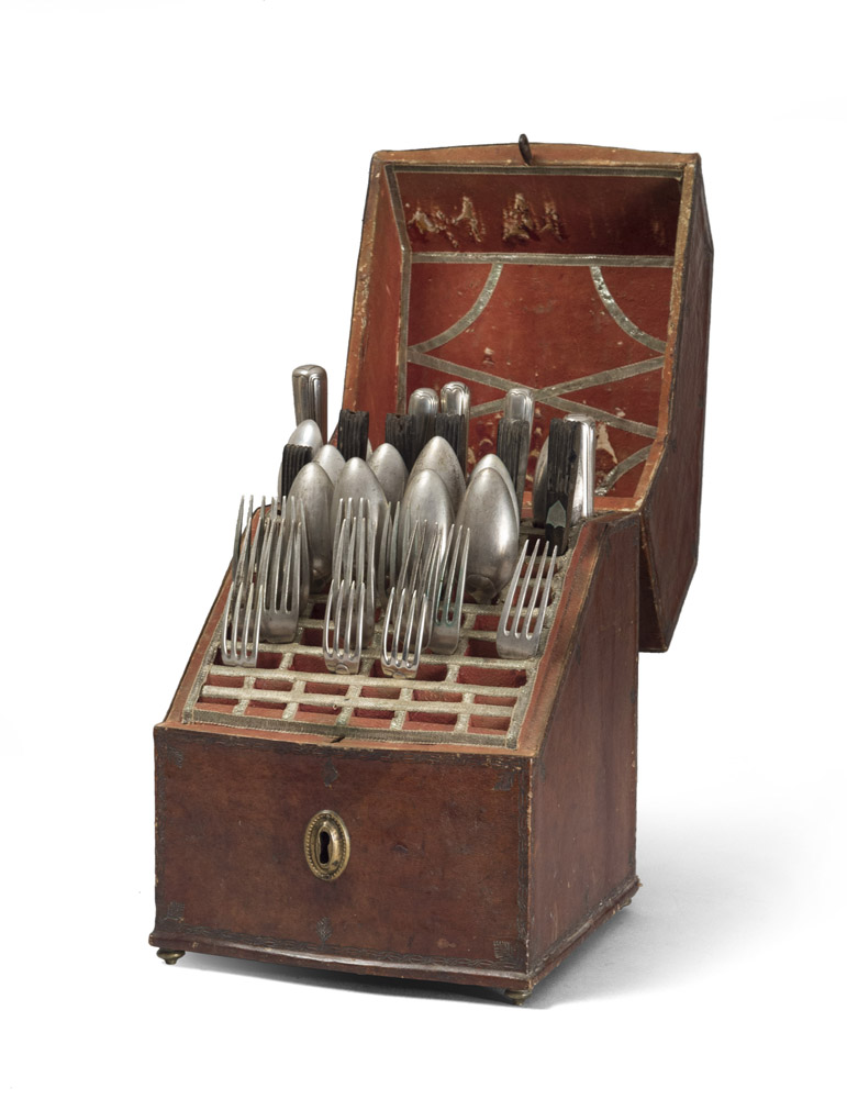 CUTTLERY CASE, 18TH CENTURY covered with engraved leather. Containing part of the silver cutlery