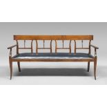 CHERRY BENCH, DIRETTORIO PERIOD with endings back bent, pierced to handrail. Seat with tapestry in