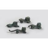 FOUR ETRUSCAN BRONZE FIGURES FELIN, 8TH-6TH CENTURY B.C. a lion figure is in relaxed pose, three