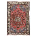 PERSIAN ARAK CARPET, EARLY 20TH CENTURY with shoots medallion of flowers and palmette and