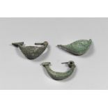 THREE ETRUSCAN BRONZE FIBULAS, 8TH-6TH CENTURY B.C. two buckles on spacecraft from the arc