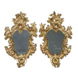 A BEAUTIFUL PAIR OF MIRRORS, NORTHERN ITALY 18TH CENTURY in gilded wood, graven to volutes,