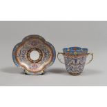 PORCELAIN CUP AND SAUCER, DRESDEN EARLY 20TH CENTURY white enamel and polychrome decorations in blue