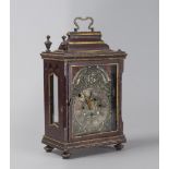 A RARE TABLE CLOCK, CENTRAL ITALY 17TH CENTURY with wooden crate in red lacquer and gold and metal