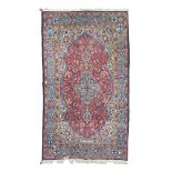 TEHERAN CARPET, MID 20TH CENTURY with medallion with flowers and secondary motives to shoots with