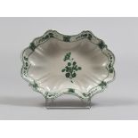 MAJOLICA DISH, SOUTH ITALY EARLY 19TH CENTURY white and green enamel, with decorations to flower and