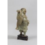 A CHINESE SERPENTINE SCULPTURE, 20TH CENTURY depicting Budai. Measures cm. 19 x 9 x 7,5. SCULTURA IN