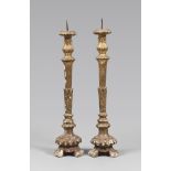 A PAIR OF GILDED WOOD CANDLESTICKS, CENTRAL ITALY 18TH CENTURY h. cm. 65. Gilding lock COPPIA DI