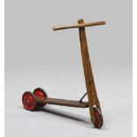 SCOOTER, EARLY 20TH CENTURY wood finishes and metal wheels. Measures cm. 67 x 70 x 13.