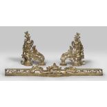 FIREDOGS, 19TH CENTURY in gilded bronze and chiseled to leaves of acanthus, volutes and