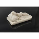 WHITE MARBLE HIGH-RELIEF, 19TH CENTURY representing sleeping baby. Measures cm. 7,5 x 11 x 19.