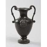 BRONZE POT, 18TH CENTURY to black patina with keys musical handles and heads of ram to the shoulder.