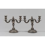 COUPLE OF CANDELABRA IN SILVER, BEGINNINGS 20TH CENTURY with braccia to volutes and base baccellata.