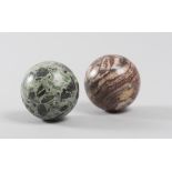 TWO MARBLE SPHERES, 19TH CENTURY in green ancient and breach of Scizo. Diameter cm. 11. DUE SFERE IN