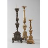 THREE WOOD FLOOR-LAMPS, 18TH CENTURY of which two in gilded wood and one lacquered to false