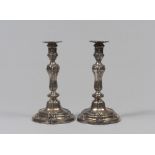 A PAIR OF SILVER CANDLESTICKS, 19TH CENTURY with chisels in leaves, acanthus leaves and rows of