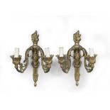 A FINE PAIR OF GILDED BRONZE APPLIQUES, 19TH CENTURY of taste Louis XVI, with two arms to ramages