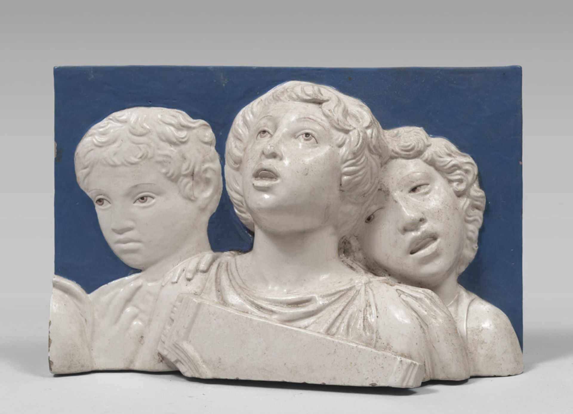 MAIOLICA HIGH-RELIEF, ROBIANO'S STYLE EARLY 20TH CENTURY to white and blue enamel, representing