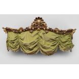 GILTWOOD AND BROWN LACQUERED CURTAIN-HOLDER, NAPLES ELEMENTS OF BAROQUE PERIOD carved to the front