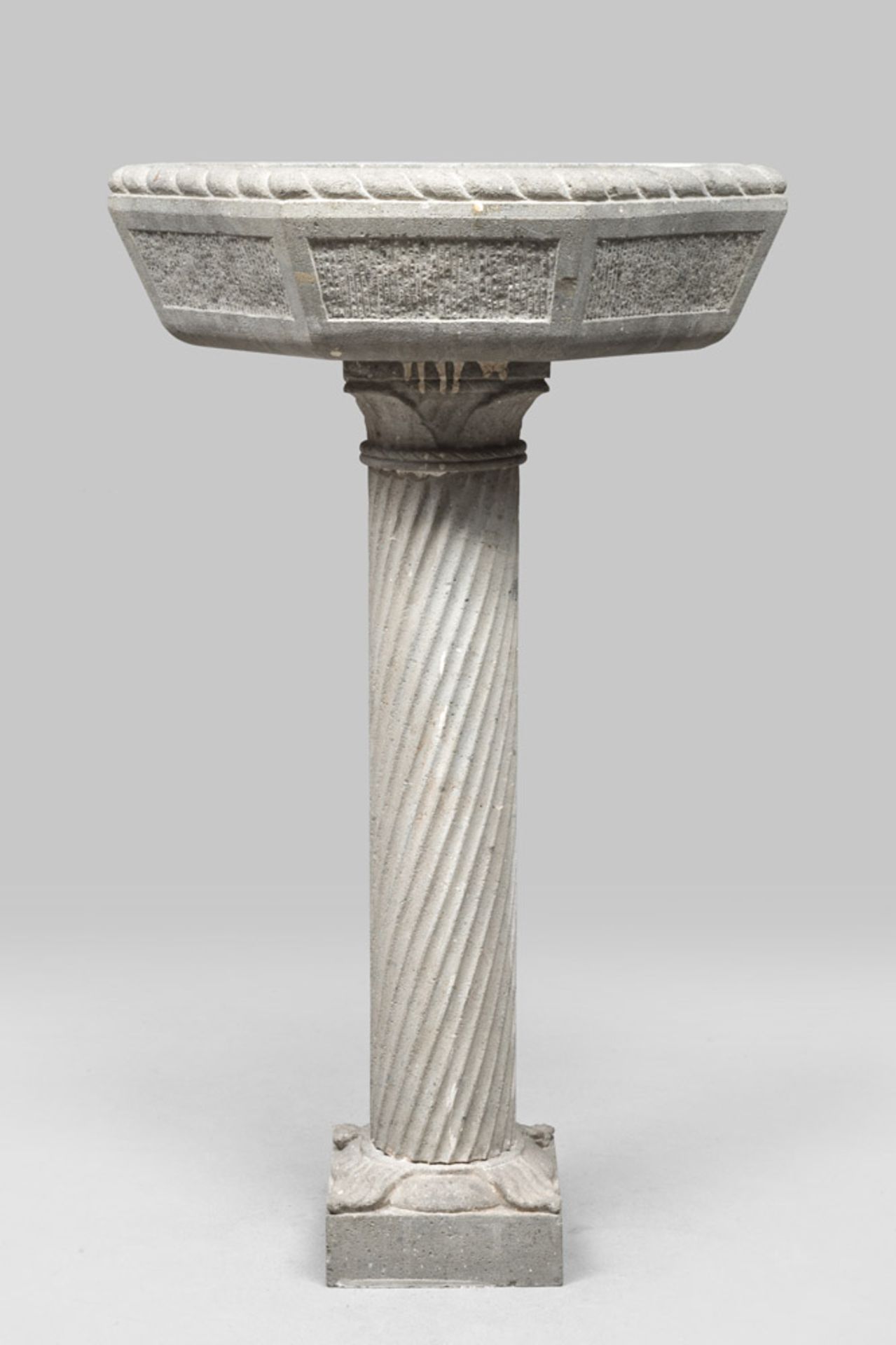 PEPERINO-MARBLE FONT, LATE 19TH CENTURY With a column of fifteenth-century taste. Bowl with rolled