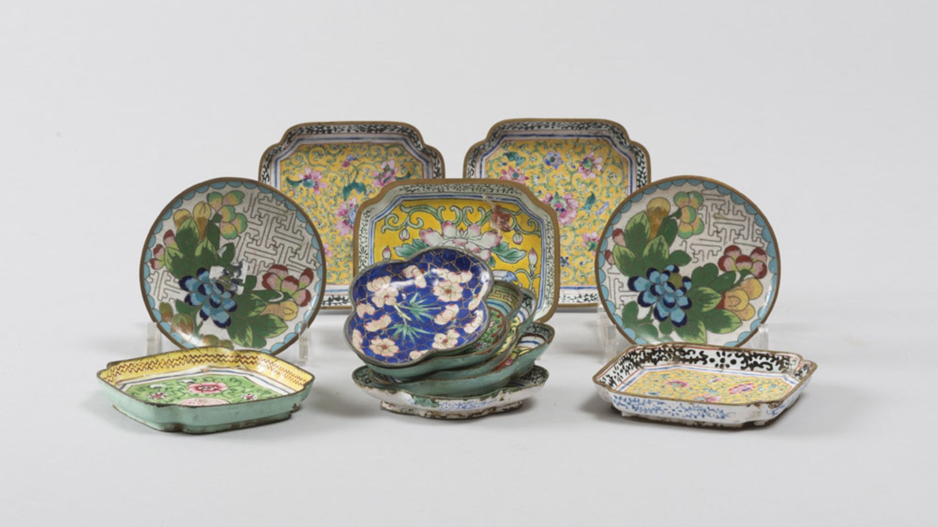 TWELVE CHINESE POLYCHROME METAL SAUCERS, 20TH CENTURY