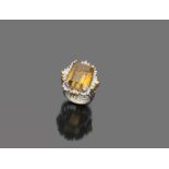 White gold ring 18 kts., with central topaz and contour of diamonds. brilliant ct. 1.30 ca., general