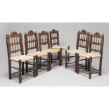 Six walnut-tree chairs with seats in straw, 19th century. Measures cm. 96 x 50 x 40.SEI SEDIE IN