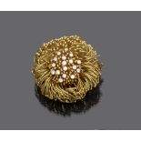 Yellow gold 18 kts. Brooch. Diameter cm. 4, brilliant ct. 0.80, general weight gr. 40,90.SPILLA in