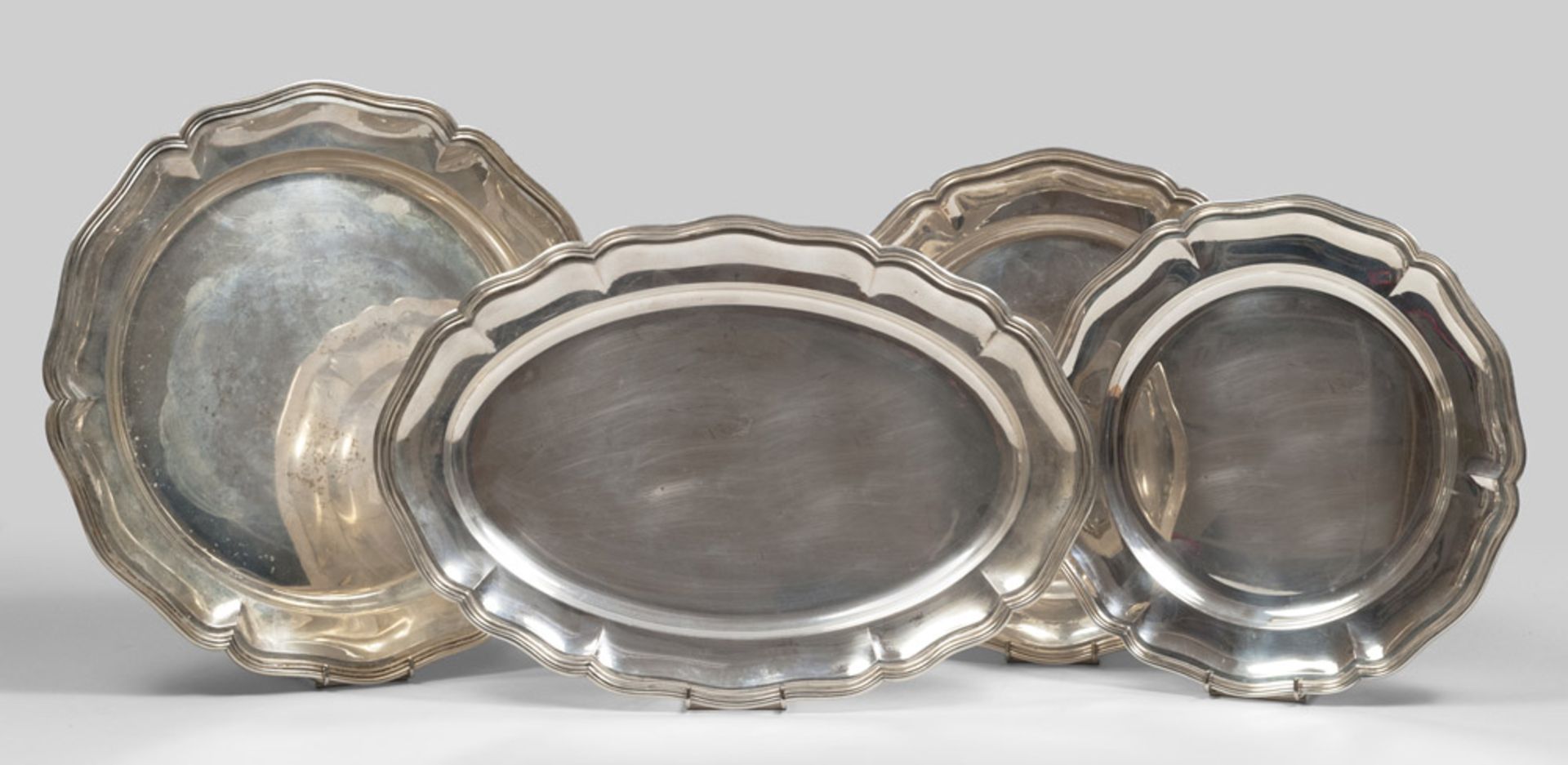 Three silver serving dishes and tray, 20th century. measures cm. 47 x 32, total weight gr. 4137.