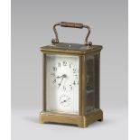 Table clock in brass with grinded glasses, early 20th century.