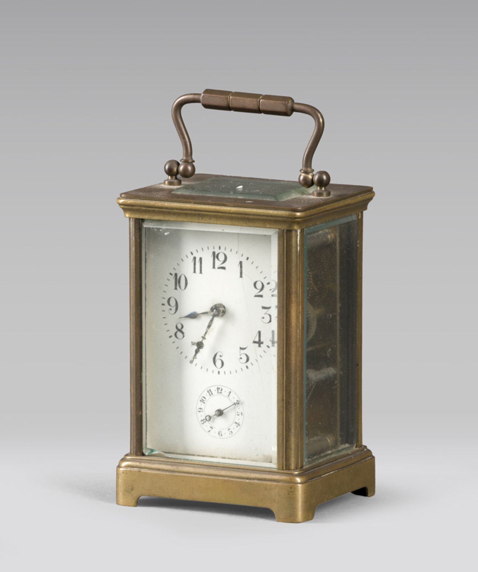 Table clock in brass with grinded glasses, early 20th century.