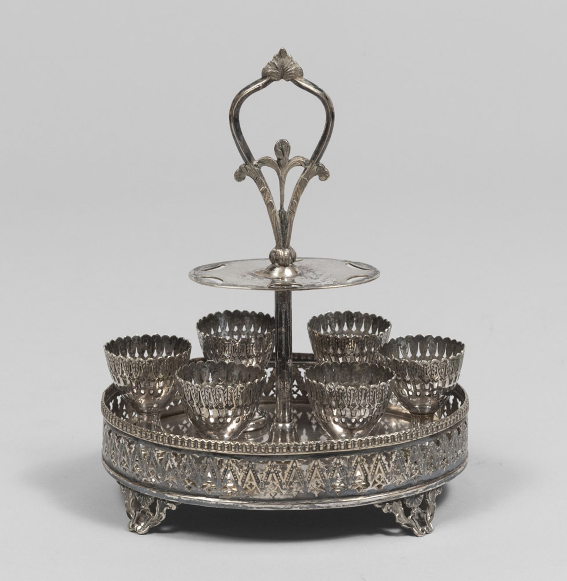 Silver egg-holder, early 20th century. Measurements cm. 27 x 15 x 21, total weight gr. 796.PORTA