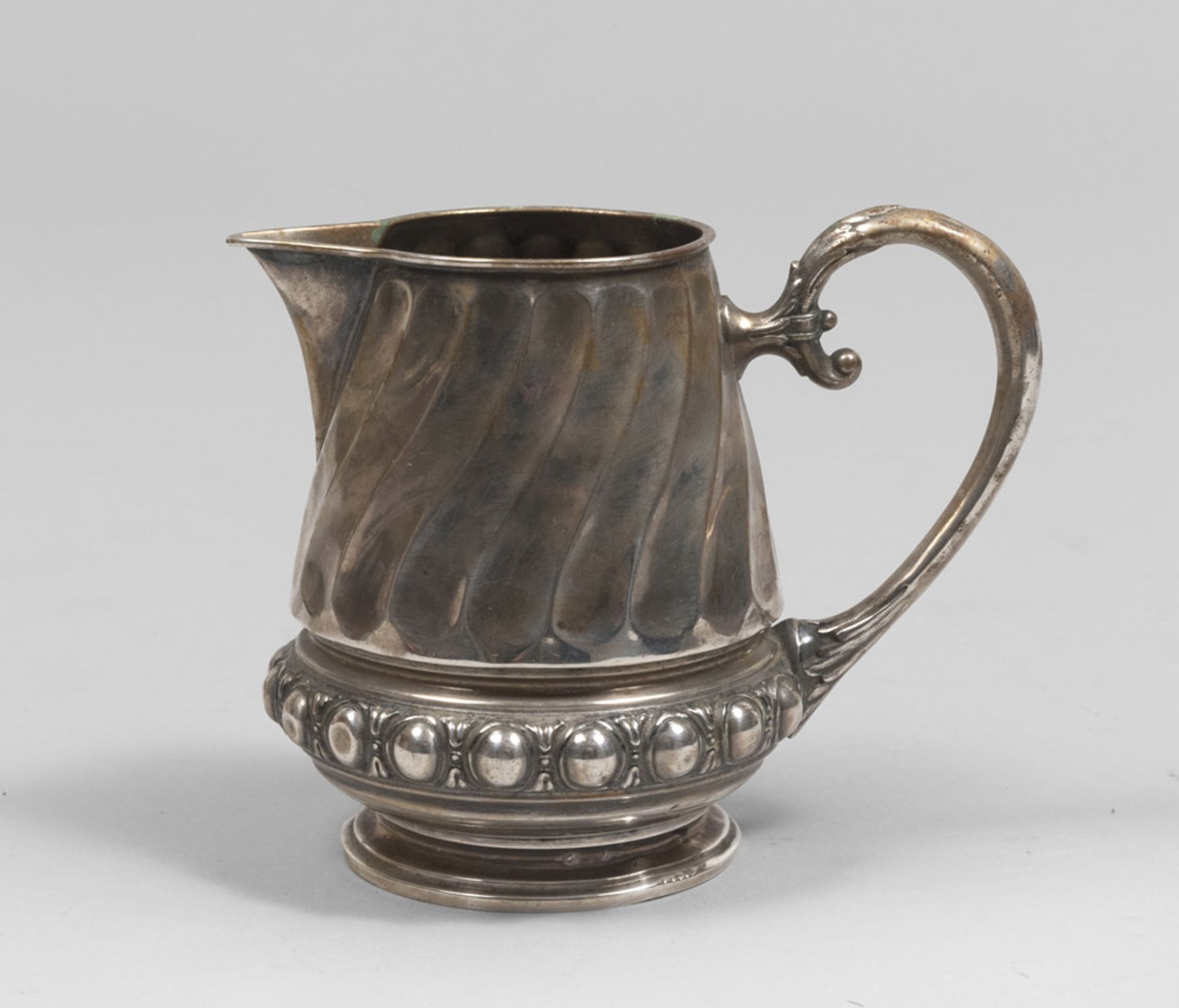 Silver milkpot, Punch Germany late 19th century. Title 800/1000. Measures cm. 12 x 10 x 14, weight