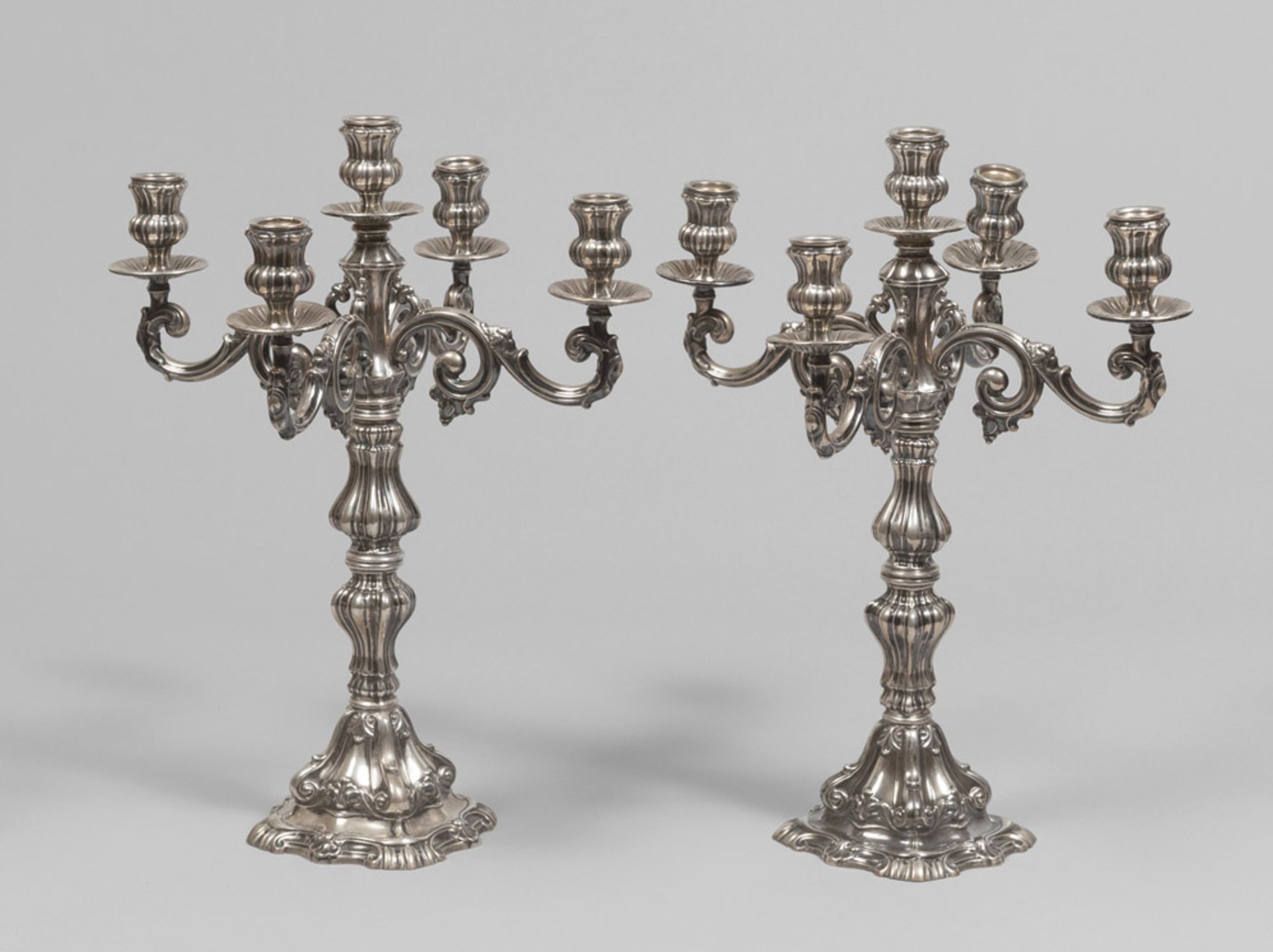 A pair of silver candelabra, early 20th century. Measurements cm. 44 x 33 x 33, gross weight gr.