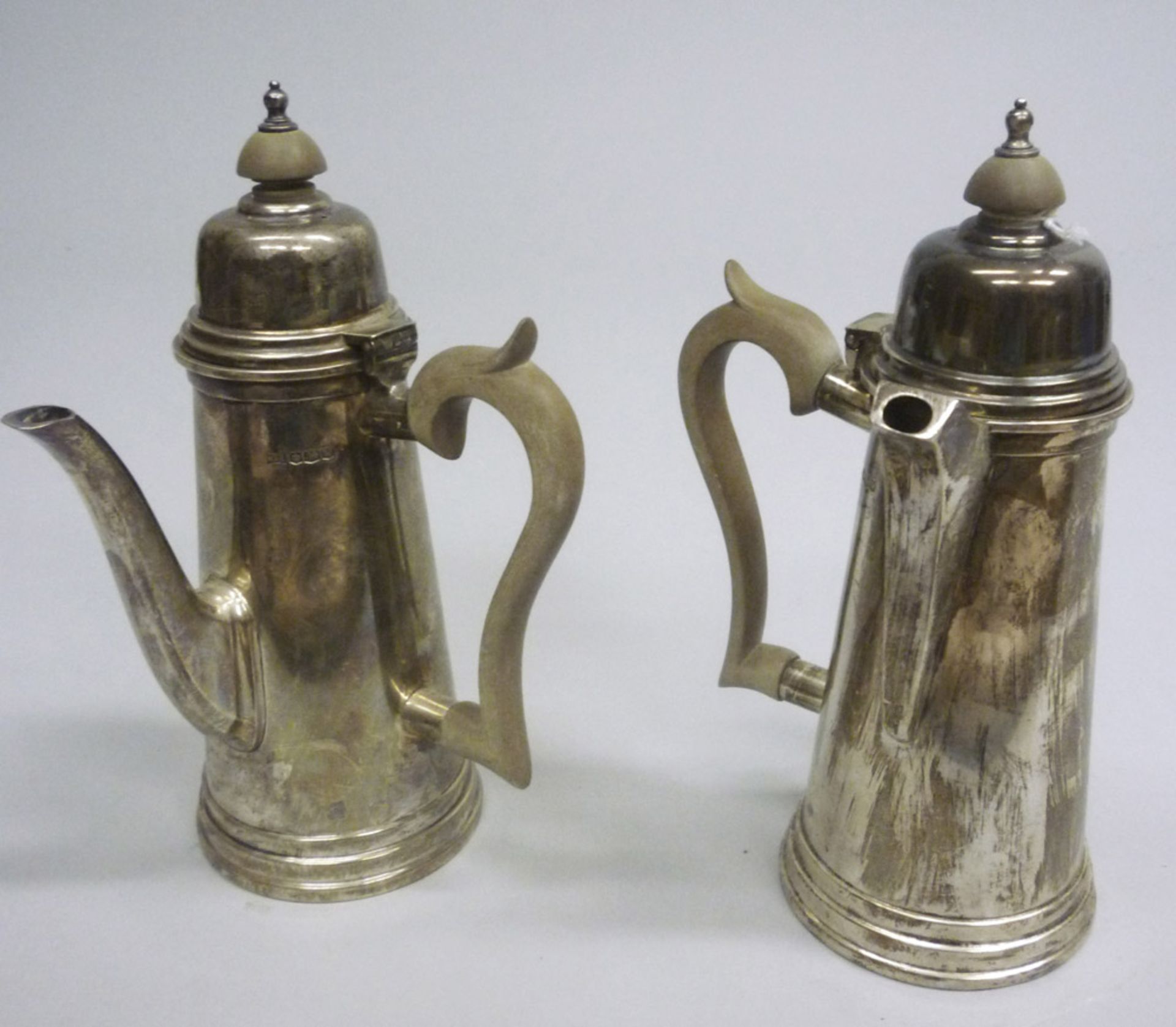 Couple of milk jugs in Sheffield with handles and knob in wood. England early 20th century.