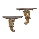 A pair of wood shelves with plain to false marble and uppercut in gilded wood, ancient elements.