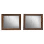 A pair of walnut-tree mirrors, 19th century. Measures cm. 82 x 70.COPPIA DI SPECCHIERE IN NOCE,