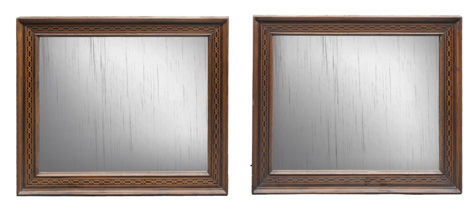 A pair of walnut-tree mirrors, 19th century. Measures cm. 82 x 70.COPPIA DI SPECCHIERE IN NOCE,