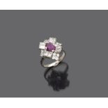 White gold 18 kts. ring, with central ruby and brilliant contours. Ruby ct. 1.00, brilliant ct. 1.