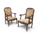 A pair of walnut-tree arm-chairs, Rome 18th century. Measures cm. 110 x 70 x 60.BELLA COPPIA DI