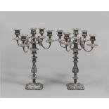 A pair of silvered metal candelabra, England early 20th century. Measures cm. 45 x 33.COPPIA DI